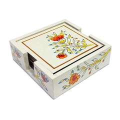 A set of hand-painted wooden coasters with a lovely floral design, protected by varnish.