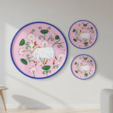 A vibrant, hand-painted Pichwai wall decor plate featuring a sacred Kamadhenu cow and lotus motifs, handmade by traditional artisans from Rajasthan.