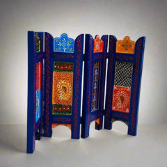 Ethnic-style wooden decor panel featuring intricate floral artwork in bold, vibrant colors.