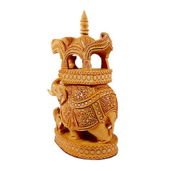 A handcrafted Ambabadi elephant on a wooden platform, a one-of-a-kind gift item.