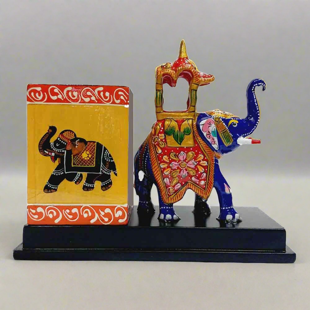 A handmade Ambabari elephant desk organizer, perfect for holding pens and pencils.