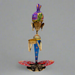 Elegant man figurine candle holder designed to create a warm and inviting home ambiance.