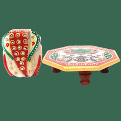 Handcrafted marble Chowki Ganesha idol with intricate artwork.
