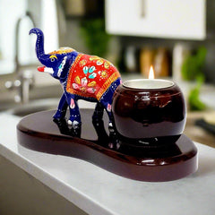 A handcrafted Meenakari elephant t-light holder, a perfect showpiece for home decoration.