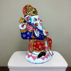 Intricately designed meenakari Ganesha idol symbolizing prosperity