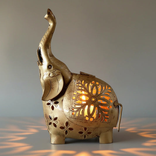 Handcrafted metal elephant figurine with internal candle holder for warm ambient lighting.