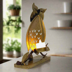 Handcrafted owl tea light holder perched on a tree branch, vintage look
