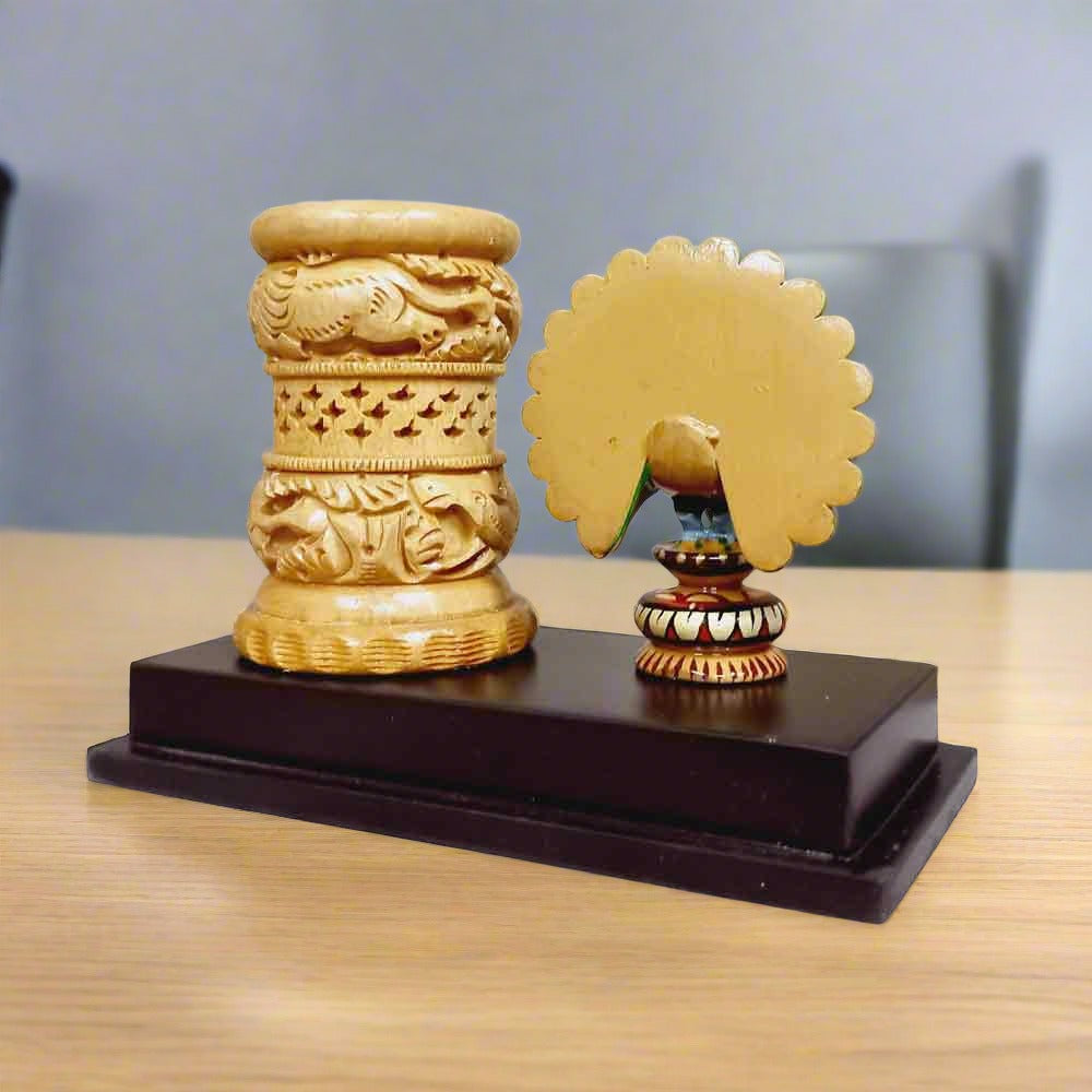 Handmade wooden pen holder with intricate peacock carving, traditional Indian handicraft