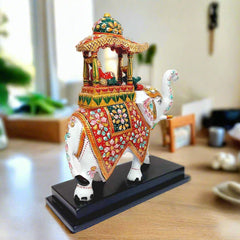 A handcrafted Rajasthani elephant souvenir, decorated in the traditional Ambari style.