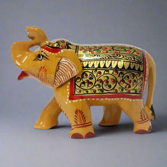 Traditional wooden elephant statue with detailed hand painting