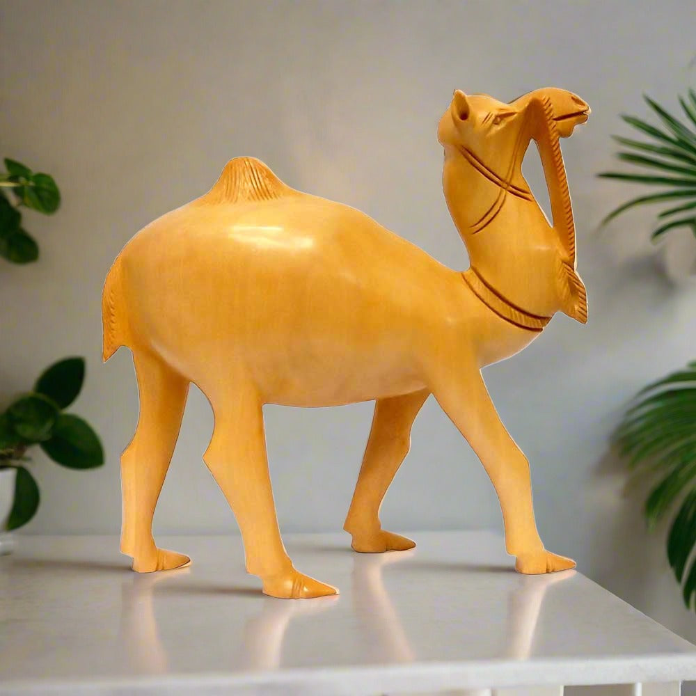 A handcrafted wooden camel statue with an amazing shape, perfect for home decor.