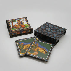 A set of 6 handcrafted wooden coasters with designer prints stored in a matching wooden stand.