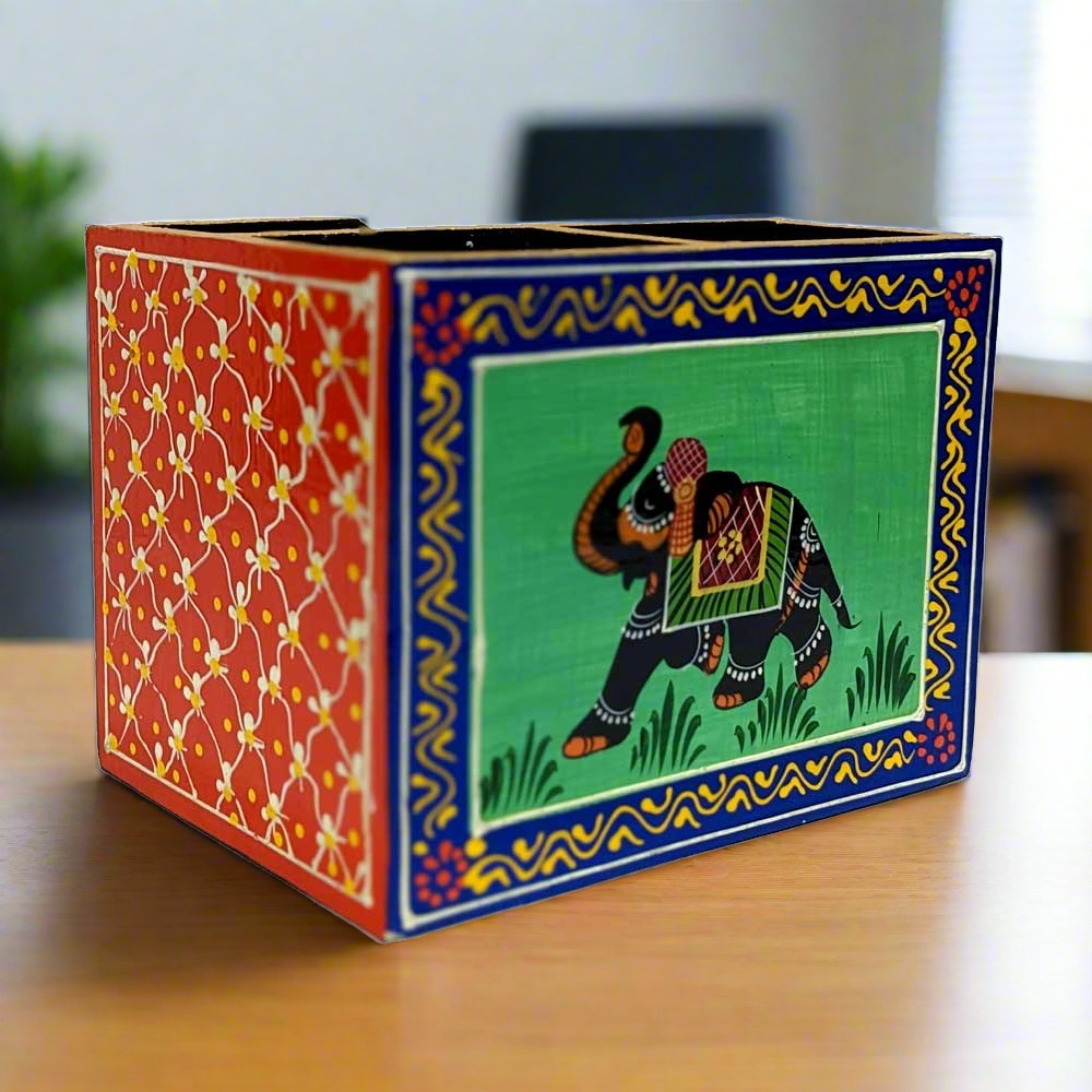 A handcrafted wooden office desk organizer with a stunning hand-painted elephant design.