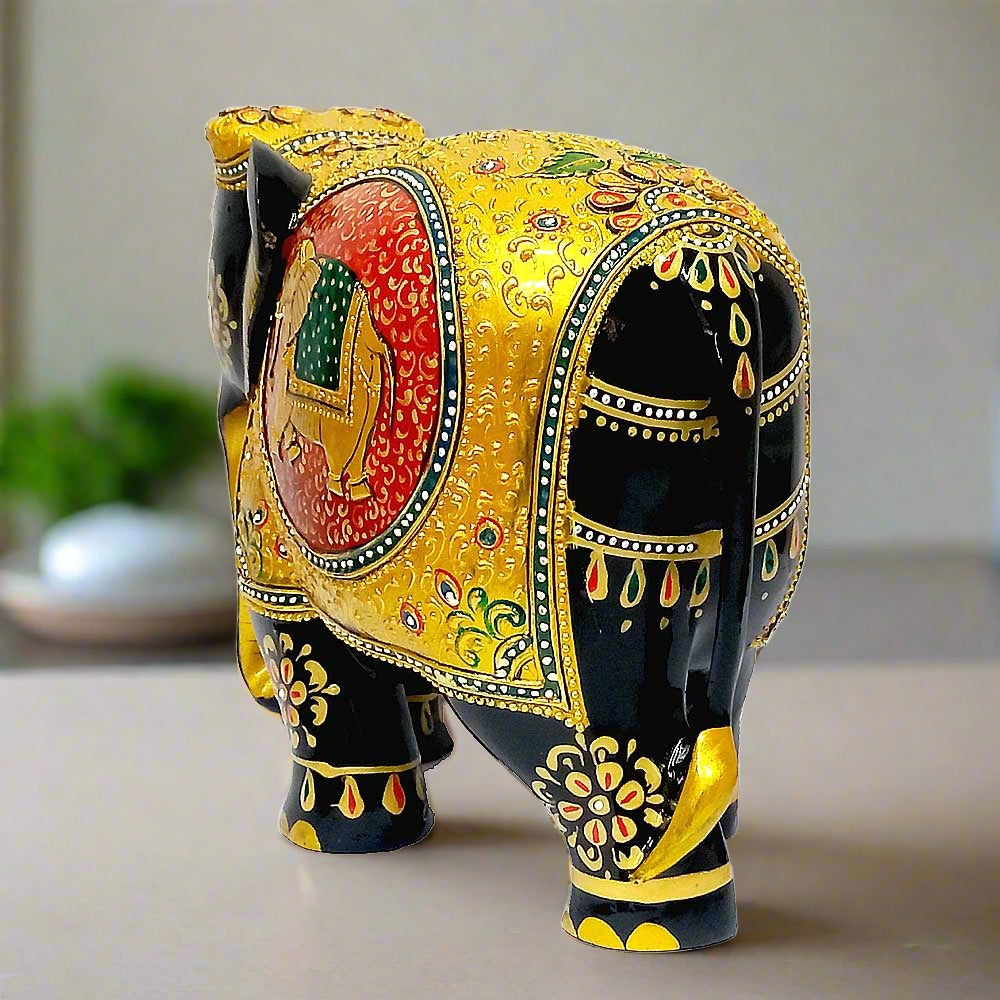 A handcrafted wooden elephant figurine with a beautiful hand-painted floral design.