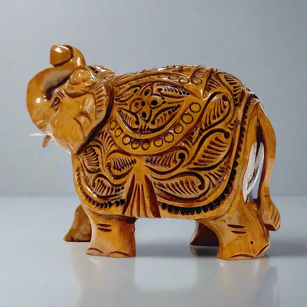 Wood carved elephant with raised trunk and salute pose – traditional decor