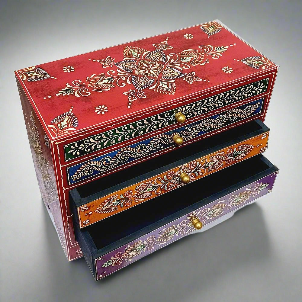 A handmade wooden box with a unique shape and beautiful embossed painting, giving it an antique look.