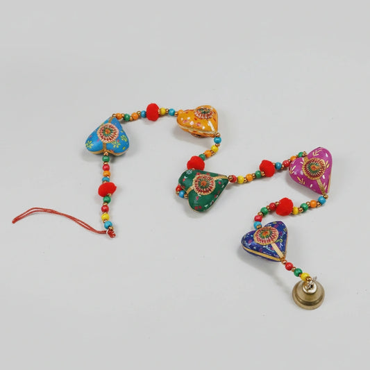 3 feet handmade Rajasthani heart-shaped hanging featuring multi-color pompoms, beads, and a decorative chime.