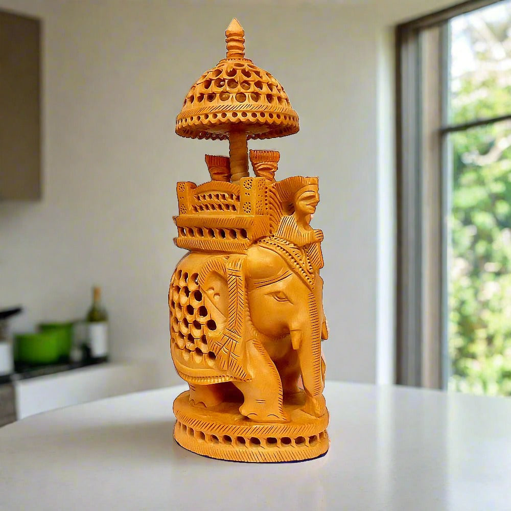 A handmade Ambabadi elephant statue crafted from a single piece of Kadamba wood.