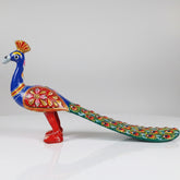 Handmade metal peacock statue with multicolor Jaipuri Meenakari enamel painting for home decor.