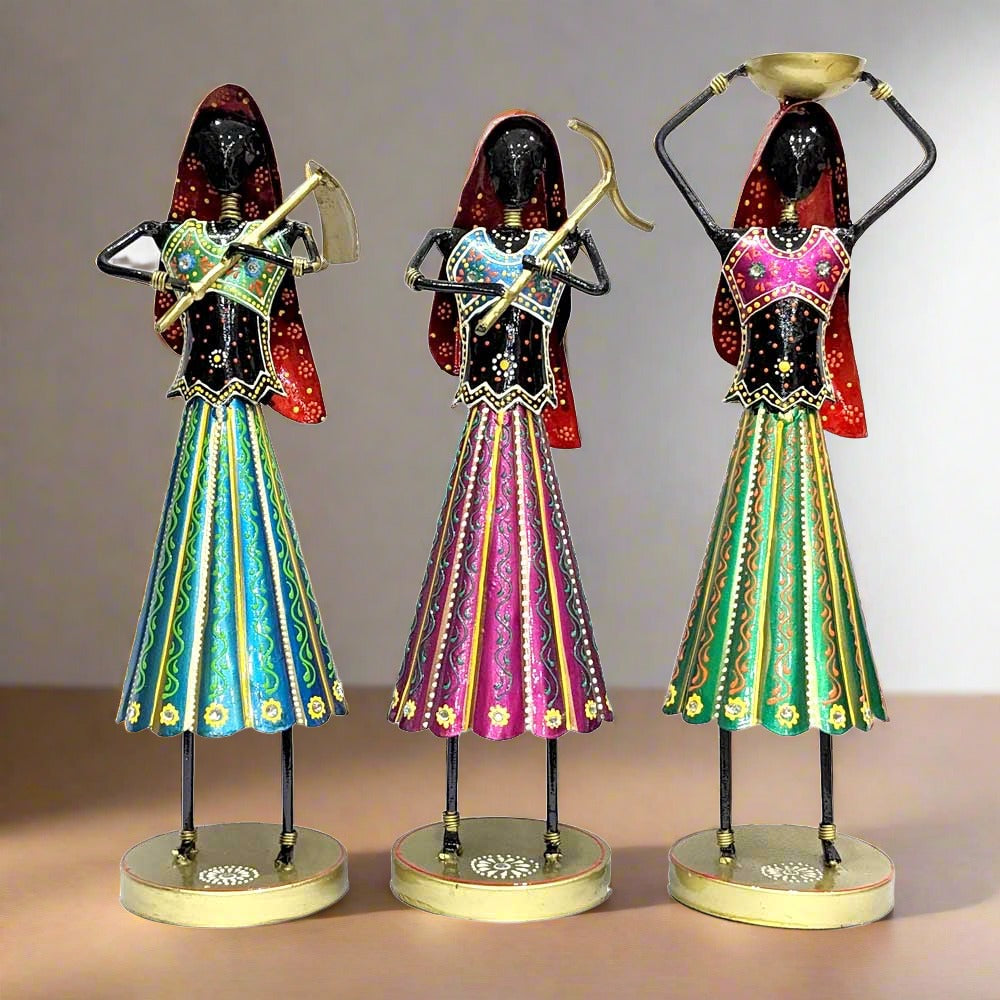 A beautiful handmade metal farmer doll set of 3 pieces with Rajasthani hand painting.