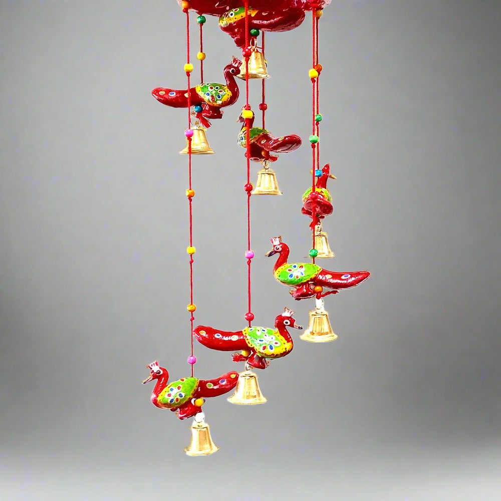 A handmade paper mache peacock door hanging, a great decoration for any room.