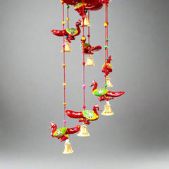 A handmade paper mache peacock door hanging, a great decoration for any room.