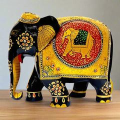 An intricate wooden elephant art piece, a captivating element for home or office decor.