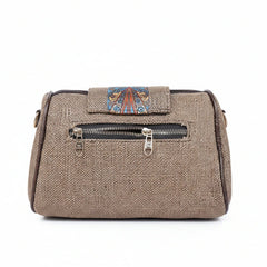 Rear view showing the secure back side zip pocket on a jacquard printed bag