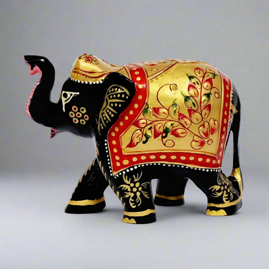 Kadamba wood elephant statue with black paint and golden embossed design.