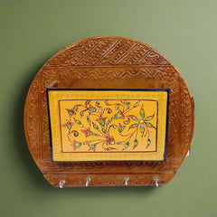 Elegant hand-painted wooden key organizer with decorative touch