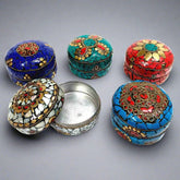 Intricately designed kumkum box with elegant stone work