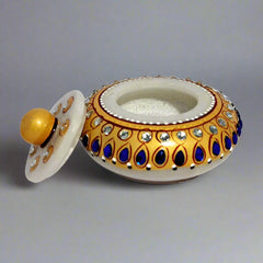 Marble kumkum box decorated with kundan stones and hand painted, perfect for storing pooja sindoor.