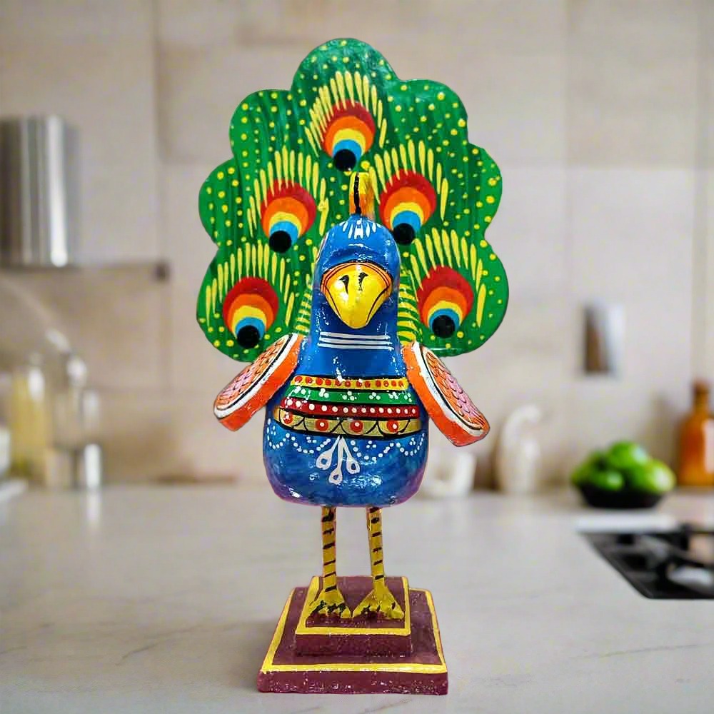 A large wooden peacock figurine, a perfect decorative piece for a home or office table.