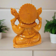 Lord Ganesha wooden idol suitable for home temple and office worship.