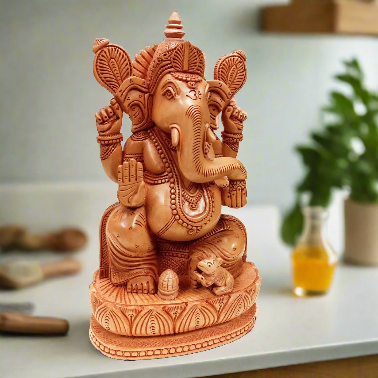 Lotus Ganesha statue made of wood with detailed traditional carving.