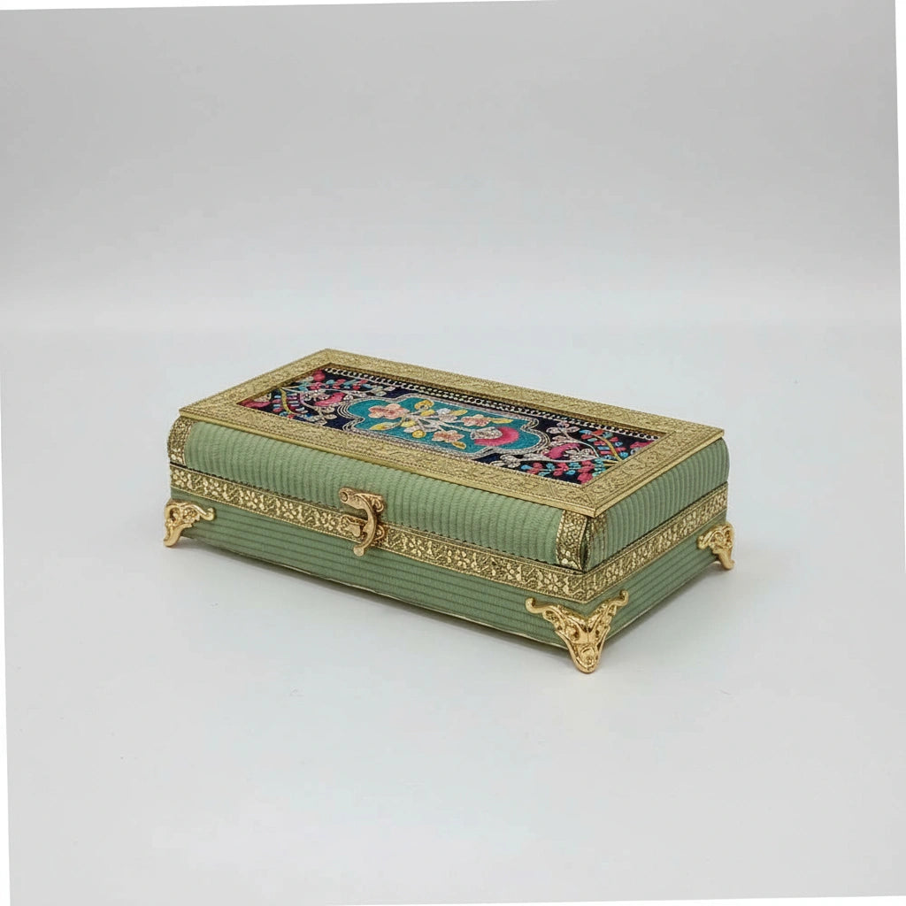 Luxury dry fruit gift box with pista colored cloth and gold accents