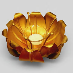 Unique lotus design metal candle holder used as a luxury home decor accent.