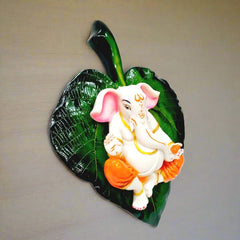 A beautiful Ganesha Ji wall art piece made of marble dust, with a hook on the back for easy hanging.