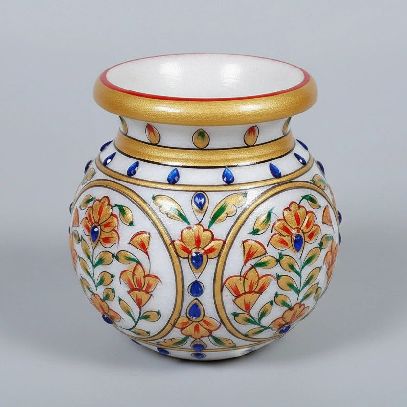Round marble pot decorated with flowers for home temple or living room decor.