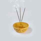 Traditional carved wood incense burner for meditation corners and yoga studios.