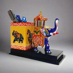 A decorative pen holder featuring a hand-painted Meenakari Ambabari elephant design.