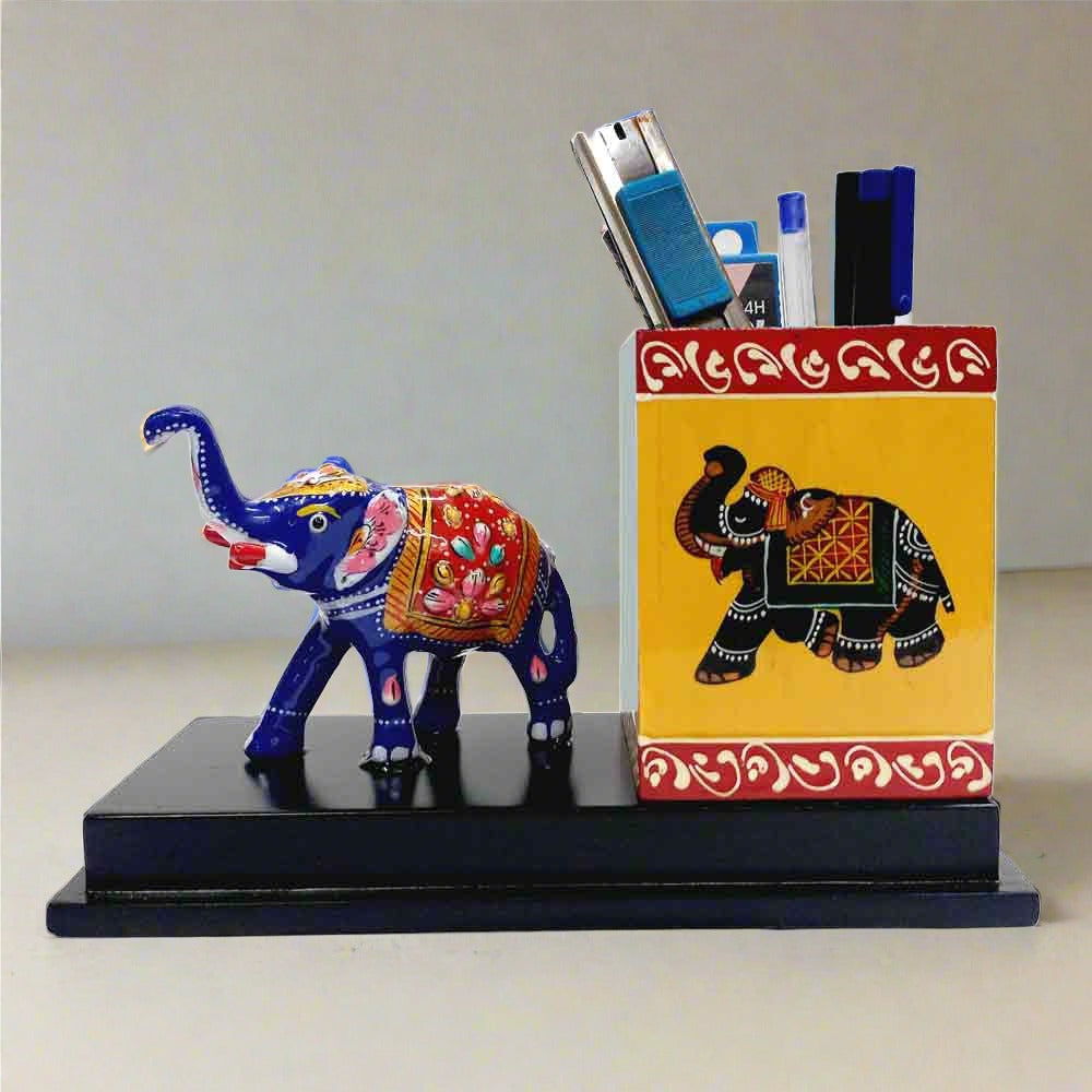 A decorative pen stand featuring a hand-painted Meenakari elephant design.