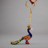 Handcrafted Meenakari peacock keychain with intricate enamel artwork.