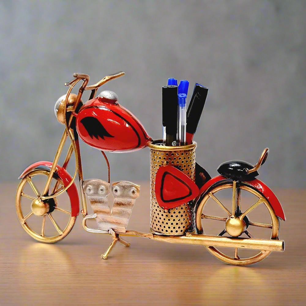 A metal bike desk accessory that holds pens and pencils, great for home and office decor