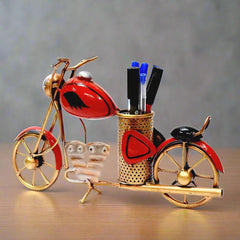 A metal bike desk accessory that holds pens and pencils, great for home and office decor