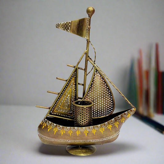 A metal pen holder with a boat design, a beautiful and sturdy showpiece for your office desk.