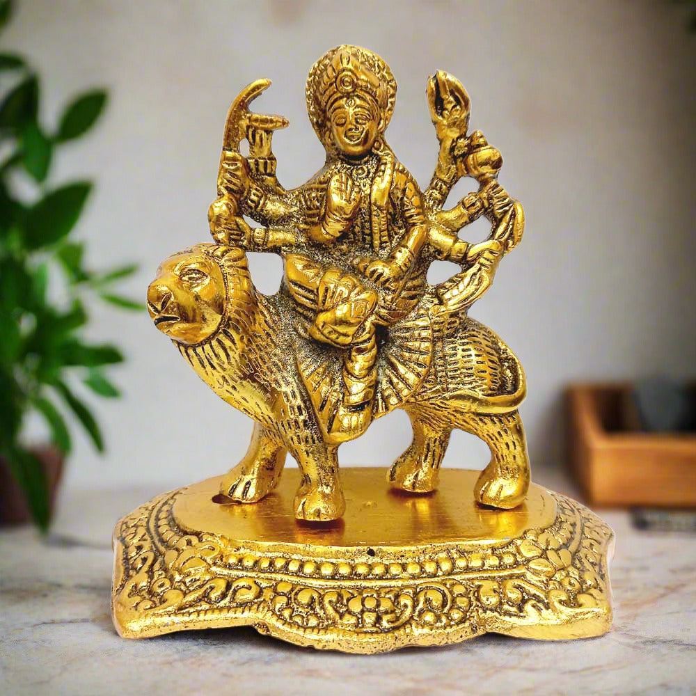 A metal Durga idol, depicting the Hindu goddess on a lion, perfect for a puja room.