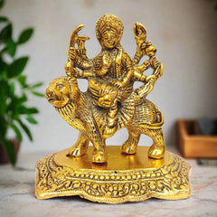 A metal Durga idol, depicting the Hindu goddess on a lion, perfect for a puja room.