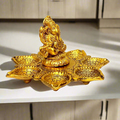 A metal Ganesh statue, a durable and thoughtful gift for a housewarming, wedding, or birthday.