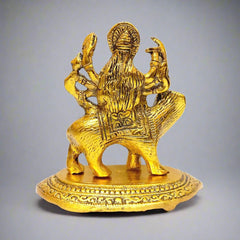 A metal figurine of the goddess Durga, a powerful and auspicious gift.